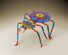 a brightly colored spider made out of yarn