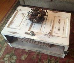 a pine cone is sitting on top of an old white coffee table in the living room