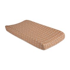 a brown and white patterned changing pad cover