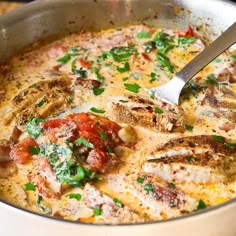 a pan filled with food and a spoon in it