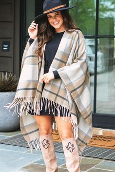 Keep warm this season in our trendy plaid poncho! These cozy plaid ponchos feature fringe along the bottom hem and an open front perfect for versatile layering. Made with a super-soft polyester and acrylic material, this poncho creates a trendy look that's easy to mix and match with your basic monogrammed tops and monogrammed boots. It is a one size fits most style and looks great paired with our Monogrammed Tunic Shirt! Fringed Long Sleeve Poncho For Fall, Fringe Long Sleeve Poncho For Fall, Long Sleeve Fringe Poncho For Fall, Fringe Shawl Outerwear For Fall, Winter Fringe Cape Outerwear, Oversized Fringe Cape For Fall, Winter Fringe Shawl Outerwear, Fall Fringe Cape Outerwear, Fringe Cape Outerwear For Fall