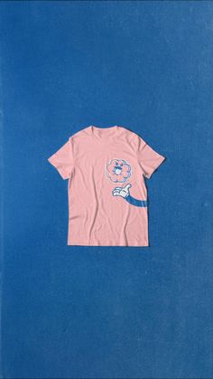 a pink t - shirt with an elephant on it