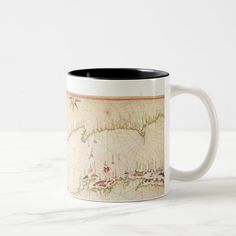 a coffee mug with an old world map on it