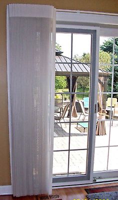 an open sliding glass door in a living room