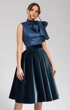 This gray velvet circle skirt is a must-have for any woman's wardrobe. It's made from 100% cotton, so it's both soft and elegant. The skirt has a high waist and a full circle skirt, which gives it a flattering and feminine look. The skirt is also lined, so it's comfortable to wear. This skirt is perfect for any occasion, from a night out to a special event. It can be dressed up or down, depending on the occasion. The gray color is versatile and can be paired with a variety of tops and accessorie Velvet Circle Skirt, Cocktail Skirt, Long Linen Skirt, Tango Skirt, Circle Skirt Dress, Cocktail Skirts, Best Gowns, Circle Skirts, Fall Wedding Guest Dress