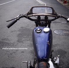 a blue motorcycle is parked on the street