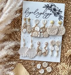 a card with buttons and seashells on it sitting next to some other items