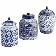 three blue and white ceramic jars with lids