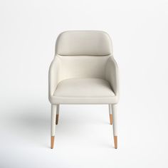 a white chair sitting on top of a white floor