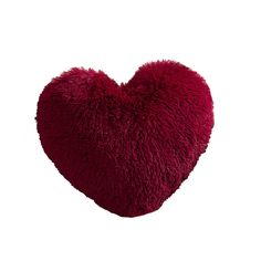 a red heart shaped pillow on a white background