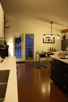 the kitchen is clean and ready to be used as a dining room or living room