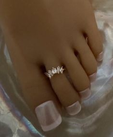 This gold toe ring features a stunning princess crown with five crystal accents that adorn the toe. This toe ring is size adjustable and one size fits most. Comfortable and versatile, it will lend itself to casual or formal events. All items are made in a smoke free environment. *If there is any issue with your toe ring, please let me know so that I can correct it. Thanks for visiting my shop!👣 Gold Toe Rings, Silver Toe Rings, Crown Ring, High Fashion Outfits, Princess Crown, Crystal Crown, Toe Rings, Glow Up?, Formal Event