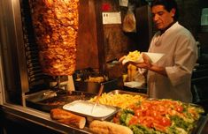 a man preparing food in a restaurant kitchen