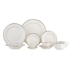 a set of white and gold dinnerware