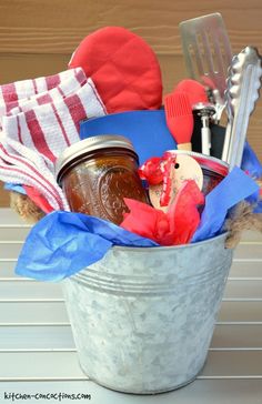 a metal bucket filled with lots of different types of things to make it look like they are