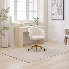 a white desk chair sitting in front of a window next to a plant on top of a wooden table