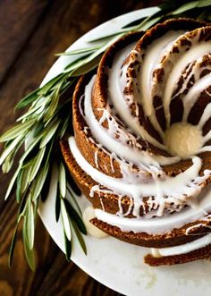 a white plate topped with cake covered in icing