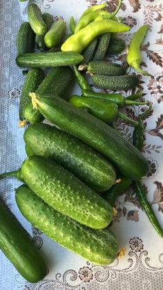 cucumbers and green peppers on a table