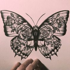 a drawing of a butterfly with roses on it