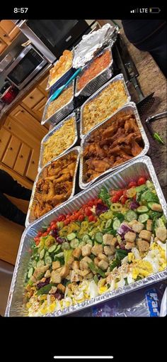 the food is prepared and ready to be eaten at the buffet table in the kitchen