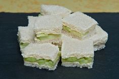 there are many small sandwiches stacked on top of each other