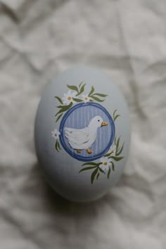 an egg with a white bird painted on it