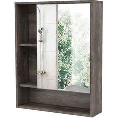 a bathroom medicine cabinet with a large mirror on the wall above it and shelves below