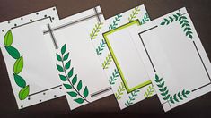 four cards with green leaves on them sitting next to each other in front of a brown background