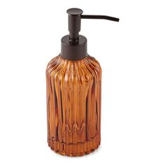 an orange glass soap dispenser on a white background