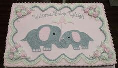 there is a cake that has two elephants on it