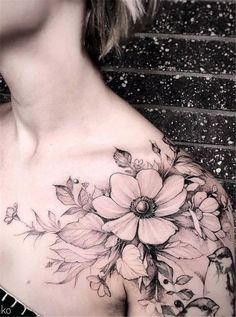 a woman's chest with flowers on it