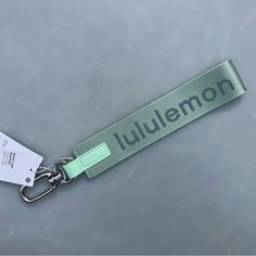 a name tag attached to a lanyard with a keychain on the end