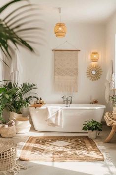 a white bath tub sitting in a bathroom next to a rug and potted plants