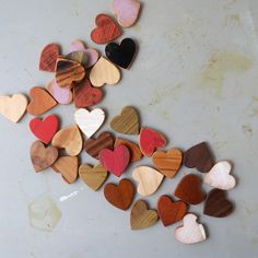 several wooden hearts laid out on a table