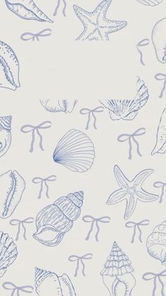 a blue and white wallpaper with seashells on the bottom right hand corner