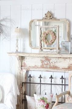 a living room with an old fireplace and mirror