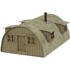 a wooden model of a barn with two windows