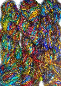 multicolored skeins of yarn are shown in this image on a white background