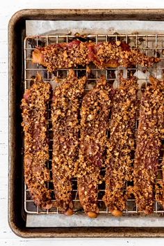 meatloaf on a baking sheet with nuts and seasoning