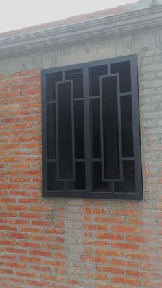 a brick wall with an open window on it