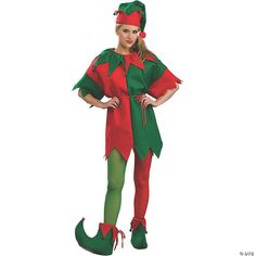 a woman dressed in an elf costume standing with her hands on her hips and legs crossed