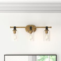 three light bathroom fixture with clear glass shades