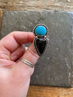 Handmade Kingman Turquoise + Black Onyx sterling silver statement ring.  -Ring will fit US size 7.5 Vintage American Southwest style design. Striking sky blue color turquoise with black onyx stone. Hand polished, rustic looking patina and high polish finish with chunky twisty rope like trim. Hand stamped Indian style Arrow and Rising Sun hallmark on backside. Chunky, double split style ring shank/band.   Turquoise stone is sourced from the Kingman mine in Arizona.   100% Sterling silver. ------- Sky Blue Color, Chunky Ring, Ring Shank, Black Onyx Stone, American Southwest, Chunky Rings, Statement Ring Silver, Color Turquoise, Southwest Style