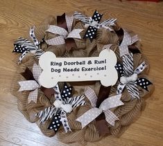 a dog themed wreath on the floor with a sign that says ring football and run dog needs exercises