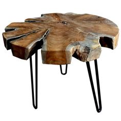 a wooden table with black hairpin legs and a piece of wood on the top