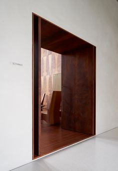 an open door with a chair inside of it