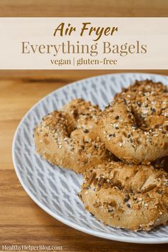 bagels on a white plate with sesame seeds