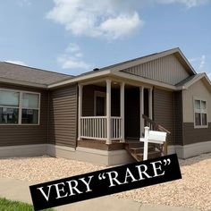 a very nice looking house with a very rare sign on it's front yard