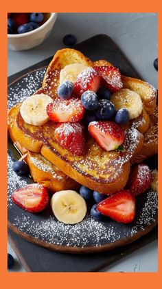 french toast topped with fruit and powdered sugar