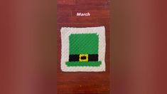 a crocheted st patrick's day potholder with a green hat on it